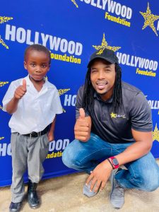 hollywoodfoundation-2. One of the Ndungane twins with a learnerHollywood Foundation partners with Akona and Odwa Ndungane for the Back to School campaign2022/2023 Handovers