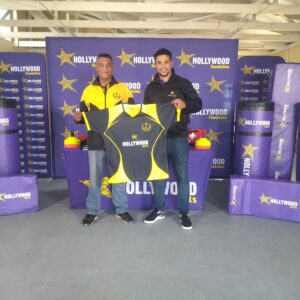 hollywoodfoundation-2. Representative from the Hollywood Foundation and Rocklands Rugby Club with the rugby contributionMeaningful rugby sponsorship for Rocklands Rugby ClubHollywoodbets iBranch MASTER