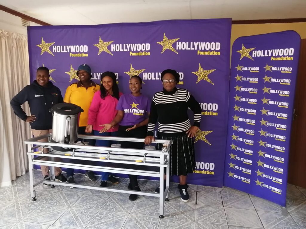 hollywoodfoundation-2. Representatives from Khomelela Community Centre and the Hollywood Foundation with the contribution.The Hollywood Foundation assists Khomelela Community Centre through a Corporate Social Investment (CSI) projectHollywoodbets iBranch MASTER
