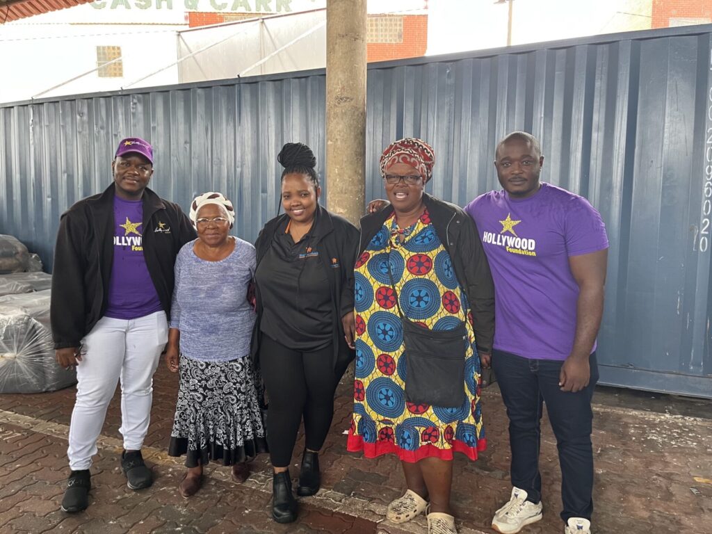 hollywoodfoundation-3. The Team pose in front of the shipping containerEsenzweni Co-operative receives Enterprise and Supplier Development (ESD) support from the Hollywood FoundationHollywoodbets iBranch MASTER