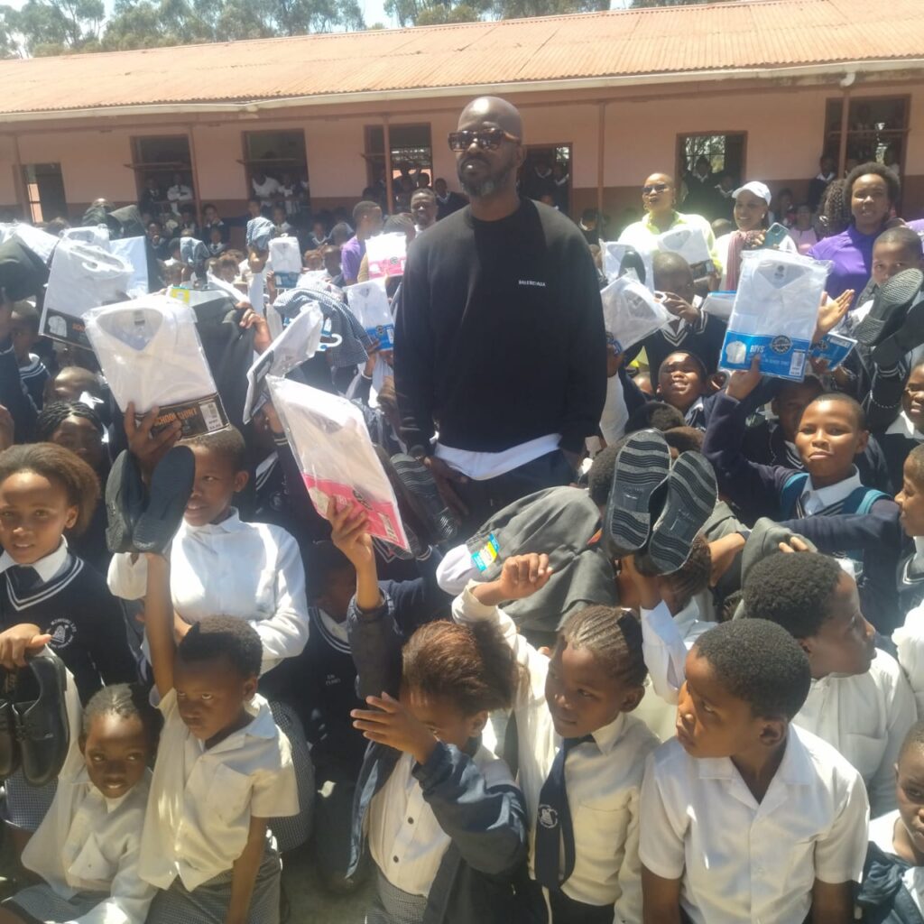 hollywoodfoundation-Black Coffee and some learners with the uniform contributionHollywood Foundation and Black Coffee Foundation unite in the Eastern Cape with the Back to School campaignBack to School Campaign