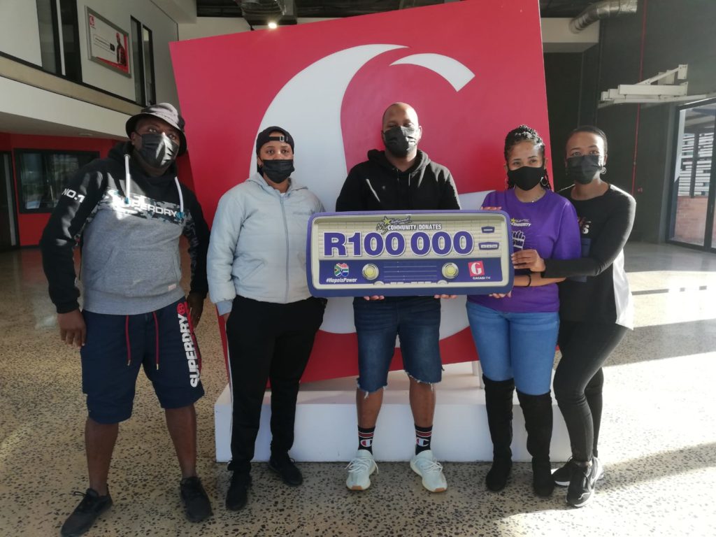 Gagasi FM with their R100 000 cheque from HopeIsPower campaign