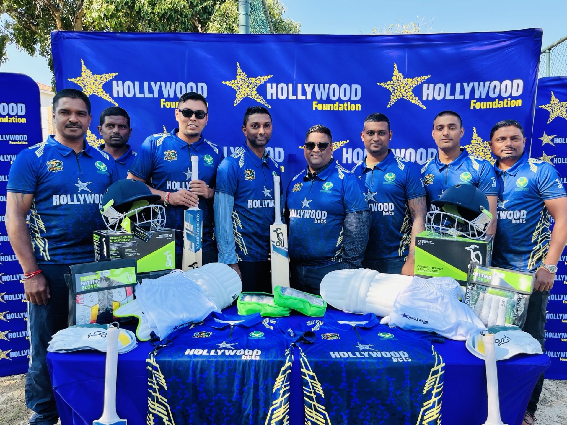 hollywoodfoundation-Players pose wearing their new kitThe Hollywood Foundation Empowers Phoenix Cricket Club Through Corporate Social Investment (CSI) InitiativeCorporate Social Investment Programme