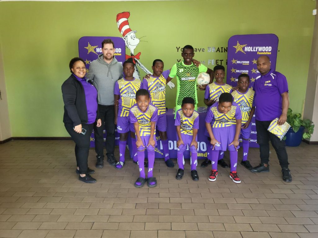 hollywoodfoundation-Ysterplaat Primary School students proudly display their new soccer kits provided through the Hollywood Foundations CSI programmeHollywood Foundation’s Corporate Social Investment (CSI) Initiative Supports Ysterplaat Primary School Soccer TeamsHollywoodbets iBranch MASTER